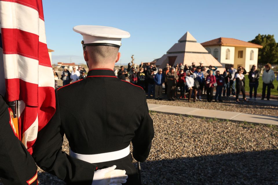 Member of the US Marines standing in front of a crowd at the Center of the World Pyramid